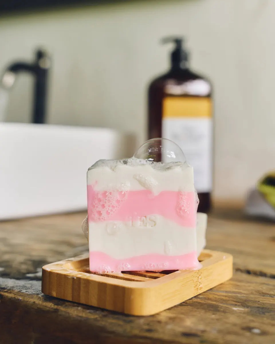 Lathered soap bar beside a 1-liter Eco Shift refill bottle