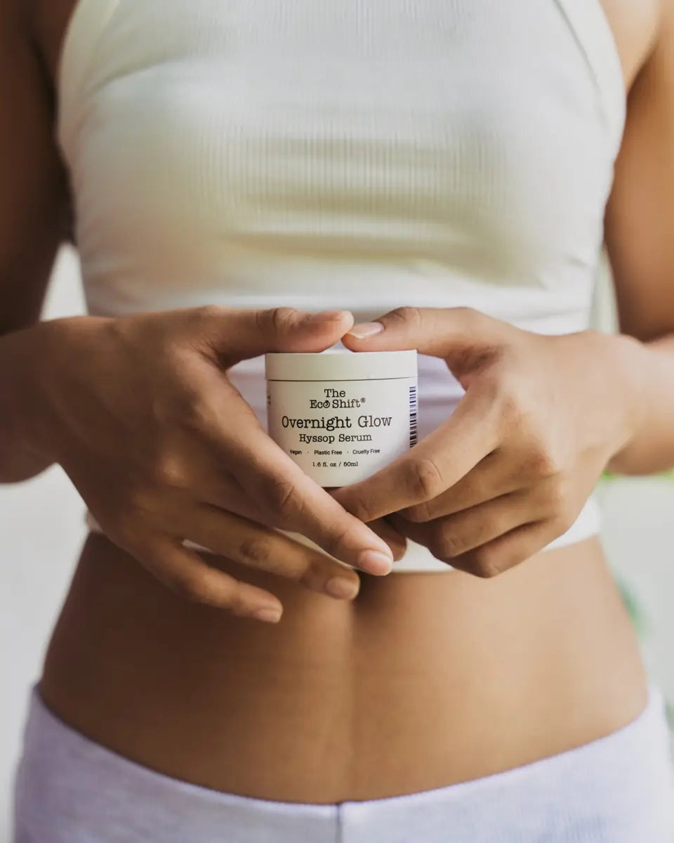 Hands holding an Overnight Glow Hyssop Serum jar